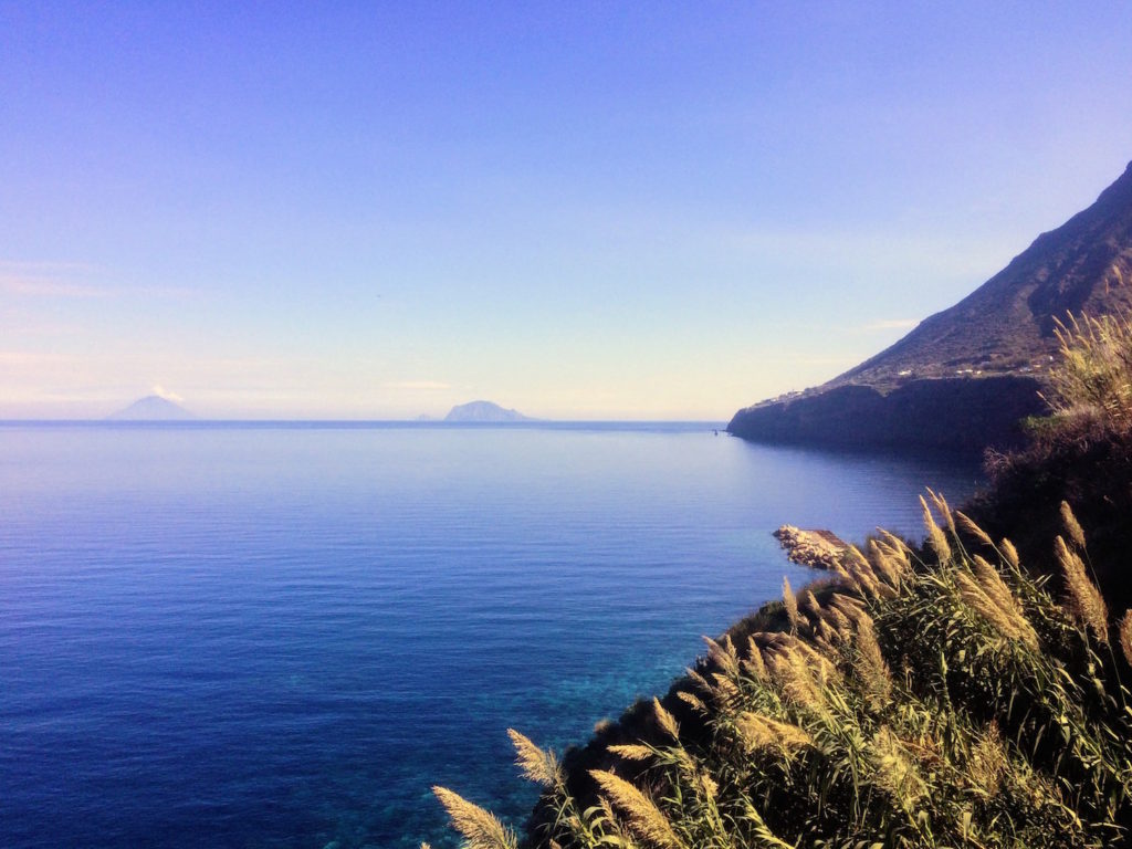 View from Malfa small pebbly cove to Stromboli
